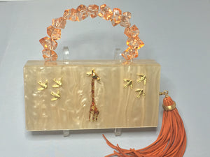 Vintage Style Creamy Peach Lucite Rectangular Clutch With Hideaway Cross-Body Chain, Long Peachy Suede Tassel Adorned With Golden Giraffe And Golden Birds Dimensions - Height 5"; Width 7.5"; Depth 1.75"