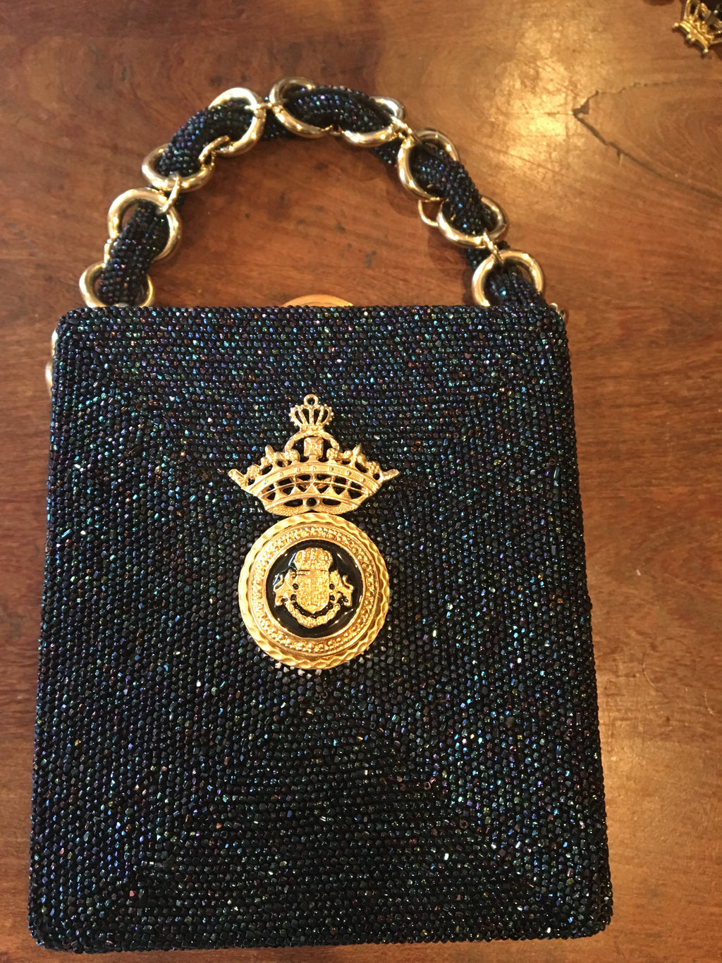 Royal, Royal, Royal. Everything about this navy hand-beaded bag is fit for a queen. You'll be the only queen who has ever been seen with this unique jewel of an evening bag.  Dimensions - Height 6"; Width 5"; Handle 5"; Depth 2"