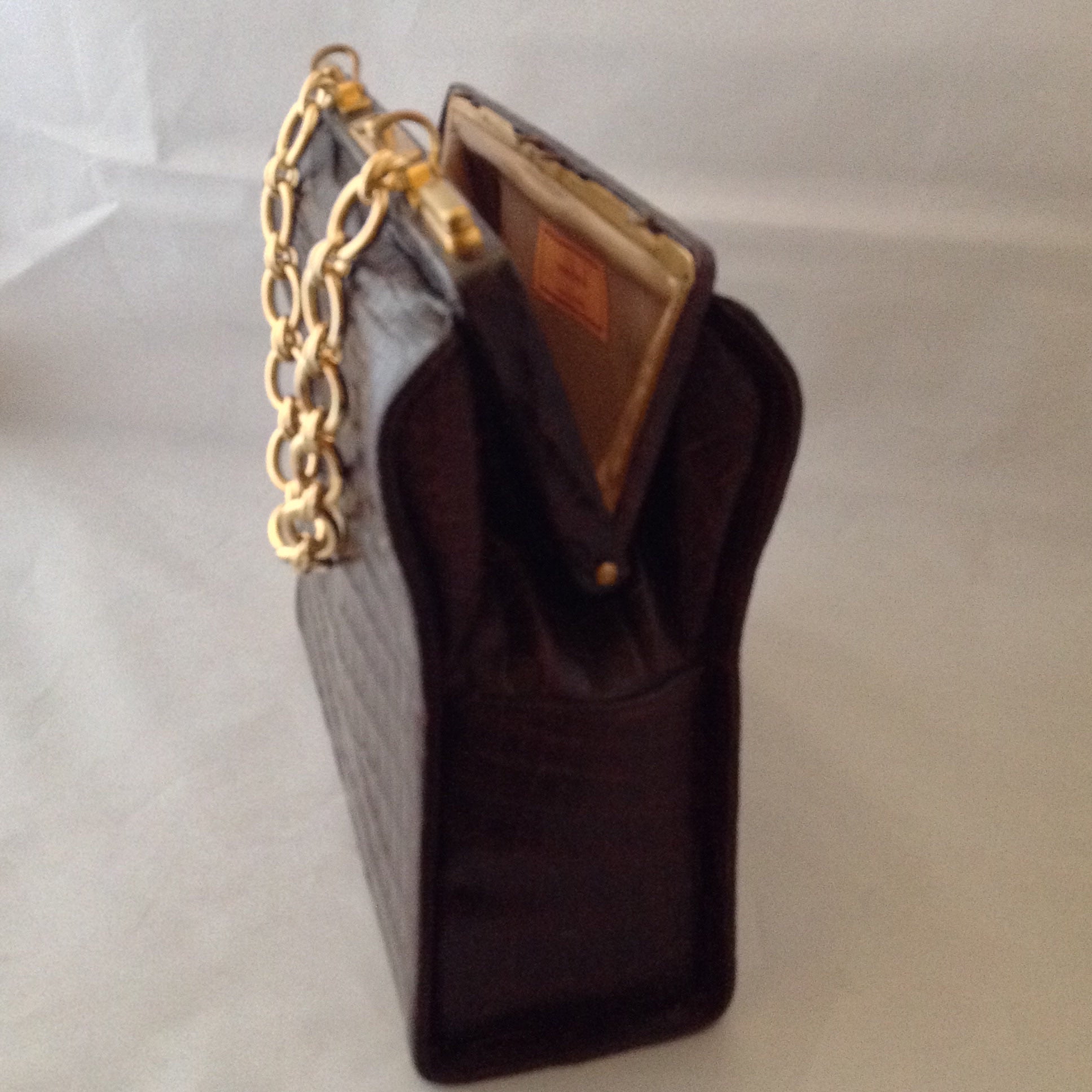 Vintage 1960s Nettie Rosenstein brown crocodile handbag with gold chain. 