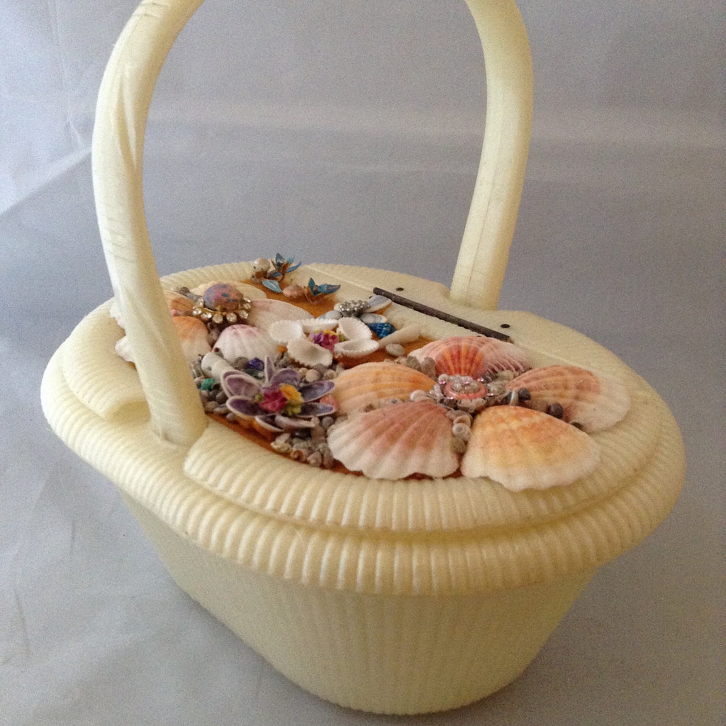 Vintage cream lucite basket purse with garden of seashells flowing the top. 