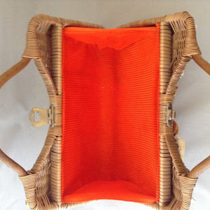 Lovely tan straw-grass purse made in Bali in the 1960s imagines a tropical sea bed with red silk lining. 1,014 shells, large and small, went into the making of this stunning piece. (Wanna count 'em?)  Dimensions - 8-1/2" Height; 13-1/2" Width"; 11 Length