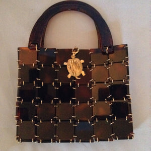 Vintage 1960's brown lucite and chain mail handbag set off with a vintage golden turtle clasp. So unique and so much fun!   Dimensions - 7" Height; 9" Width; 12" Length with handle