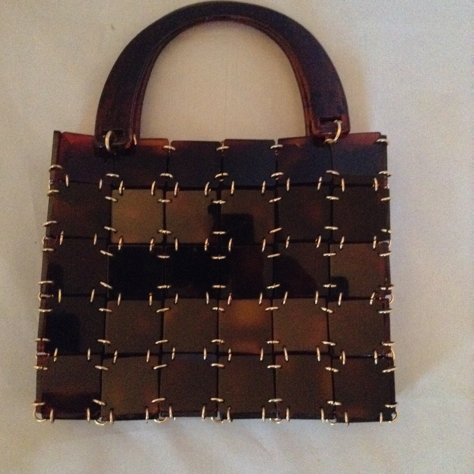 Vintage 1960's brown lucite and chain mail handbag set off with a vintage golden turtle clasp. So unique and so much fun!   Dimensions - 7" Height; 9" Width; 12" Length with handle