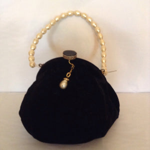 This elegant black velvet vintage purse with pearls is every gentlewoman's go-to bag.