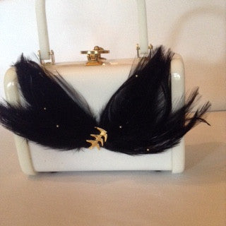 Black feathers, pearls and a flight of songbirds enhance this vintage white lucite bag by famous European maker Walburg circa 1940.  Dimensions - Height 5 3/4"; Length 7 1/2"; Handle 4': Depth 3"