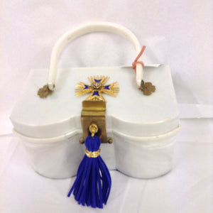 Unusual shape, color, hardware and vintage Maltese cross make this white lucite purse a necessity for your summer vacation to the Islands. White whites and blue blues with shiny brass accents complete the nautical theme of this fantastic classic.  Dimensions - Height 4"; Width 7 1/4"; Length 8 1/4"; Depth 4"