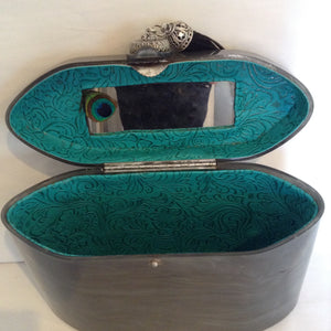 1940s Wilardy lucite purse in swirls of grey. Black suede tassel, vintage medallion closure, lined in luscious peacock green, original mirror. Very unusual shape; sophisticated and collectable.  Dimensions - Height 6"; Width 8"; Depth 5"; Handle 4"