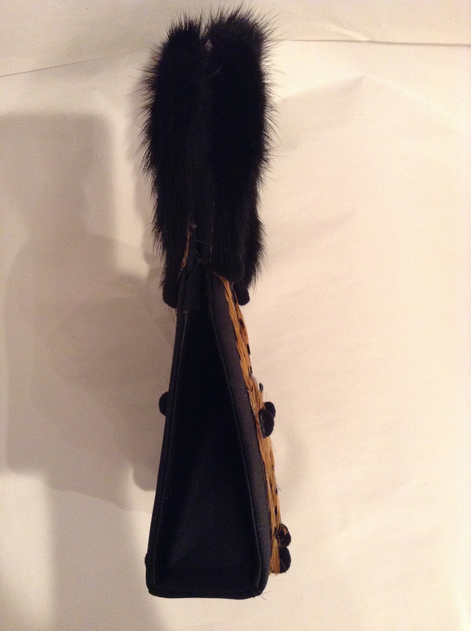 Vintage Julie Feldman purse.  Real mink handles, bird feathers and tiny pom-poms are charming additions to this classic black satin bag.  Its unique shape and style works as well for day as for evening.  Dimensions - Height 6-1/2"; Width 5-1/2"; Depth 2"; Handle: 5-1/2"