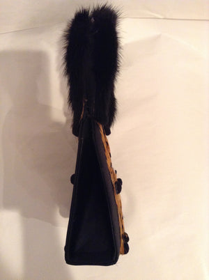 Vintage Julie Feldman purse.  Real mink handles, bird feathers and tiny pom-poms are charming additions to this classic black satin bag.  Its unique shape and style works as well for day as for evening.  Dimensions - Height 6-1/2"; Width 5-1/2"; Depth 2"; Handle: 5-1/2"