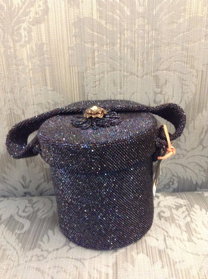 This lusciously beaded circular handbag is a vibrant royal blue that sparkles like a star-filled night sky.  Topped with a vintage pearl and enamel medallion; it will take you everywhere in celestial style.  By Walborg, Paris circa 1940.  Dimensions - Height 6"; Diameter 5"; Handle 5"