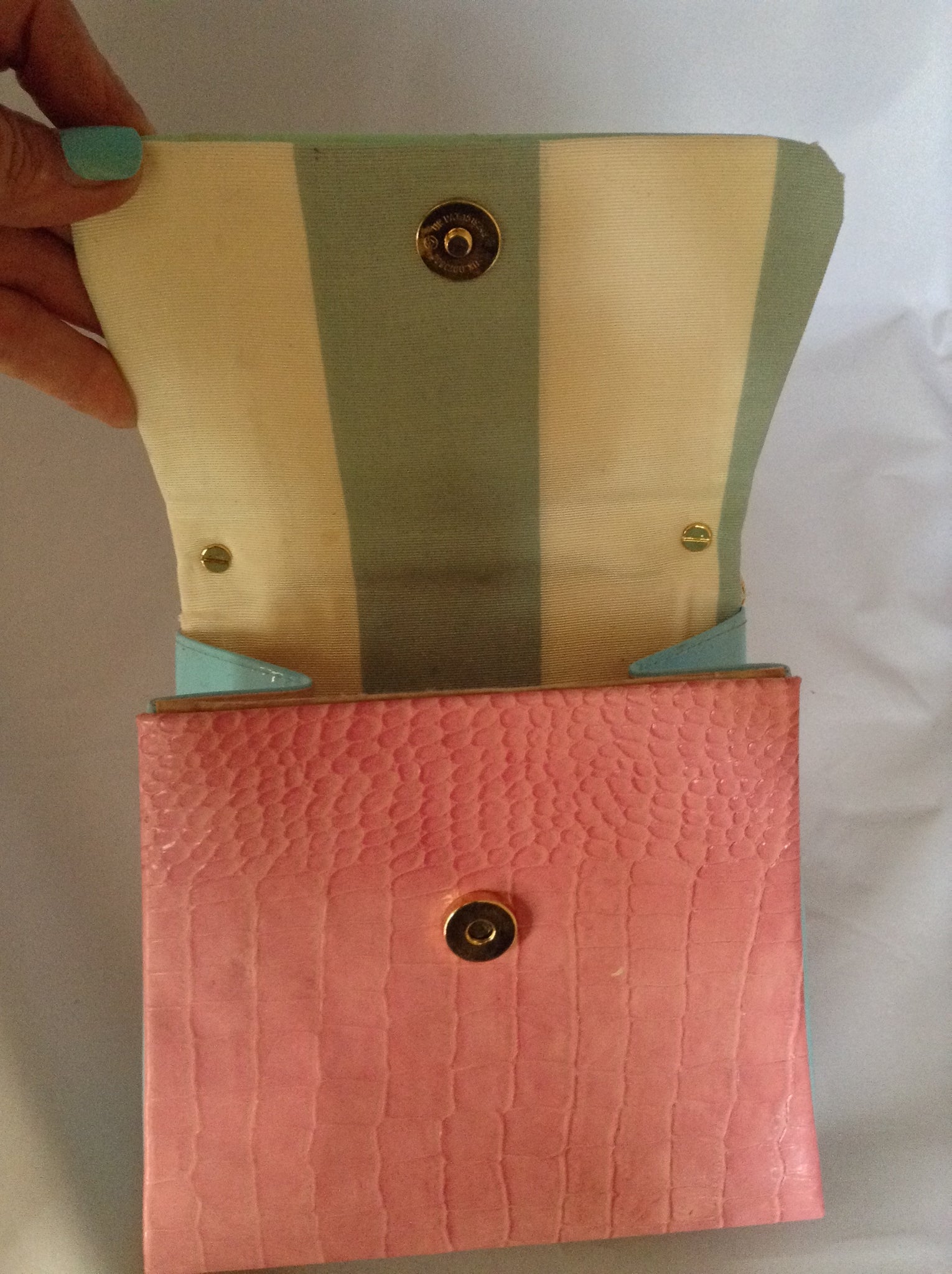 Faux croc in pink and sea-foam patent leather adorned with crystal beads and a pink suede tassel, this 60's bag has a new life with its striped silk lining and detachable cross-body cord.  Dimensions - 7" Height; 7.5" Width; 3" Depth; Handle 4"; Cord 22"