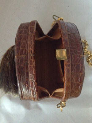 Beautiful brown South American vintage crocodile purse, a vintage Austrian hunting token, and a simple classic shape. The heavy chain detaches to be worn as a necklace or bracelet which looks and feels like 18K gold!  Dimensions - Height 5.5"; Length 7.5"; Width 3.5"; Chain 28"