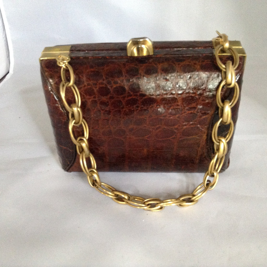 Vintage light brown crocodile lunchbox purse with original gleaming brass hardware and unusual heavy chain. Roomy, classical and timeless.  Dimensions - 7" Height; 5" Length; 3-1/2" Depth