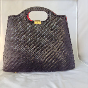 Super cool black straw vintage bag from Neiman Marcus. Red silk lining, over-sized suede tassel, wonderful hardware. Makes a statement. All you need is the right hat. A big one. Audrey would approve.  Dimensions - Height 14"; Width 14"; Depth 3"