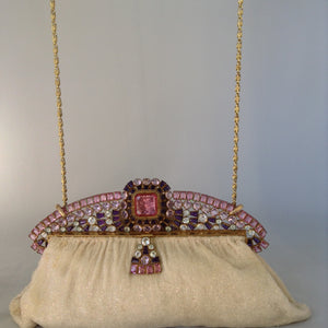 Vintage original cream beaded purse with a crown-like-handle adorned with pink, purple & white jewels, silk lining and a golden cross-body removable chain so you can gracefully toss those beads from your MardiGras float! Ooh-la-la! Magnificent, My Dear!  Dimensions - Height 6.5"; Length 9.5"; Depth 2"