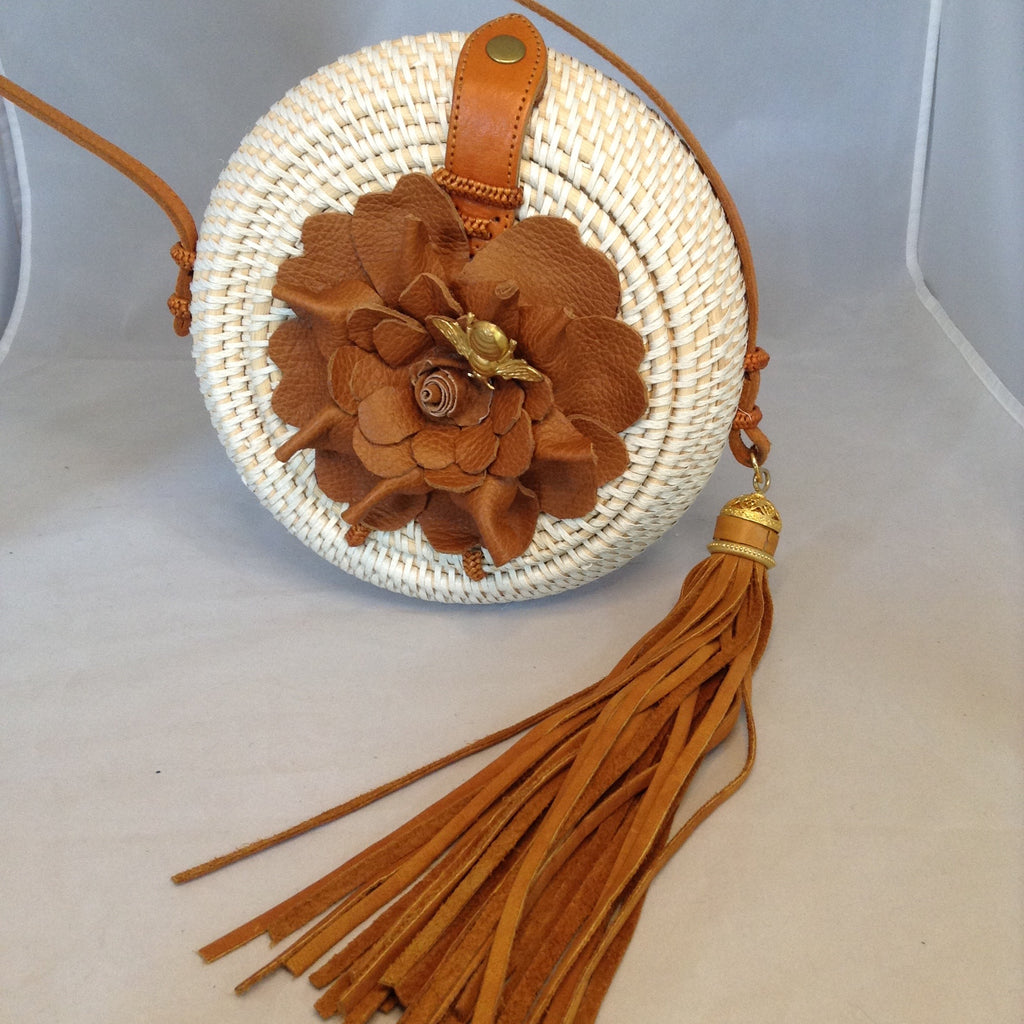 Vintage Creamy Straw Circle Crossbody Purse With Large Brown Leather Tassel And Matching Handmade Flower With Golden Bee. Multi-Colored Flower Design Cotton Lining. Dimensions - Diameter 8"; Depth 3.75"; Strap 19.5"