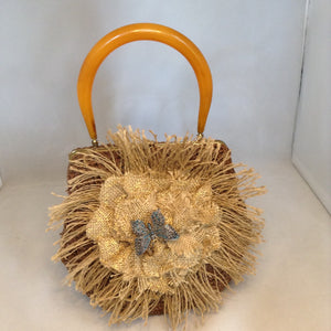 Vintage Brown Raffia Purse Signed MM With Original Amber Lucite Handle And Vintage Marquasite Blue Butterfly On Handmade Tan Burlap Rose. Dimensions - Height 7"; Length 9.5"; Depth 5.5"; Handle 5"