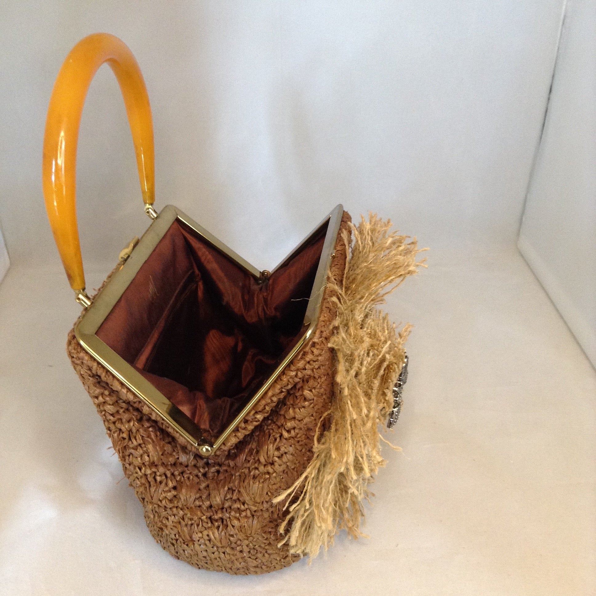 Vintage Brown Raffia Purse Signed MM With Original Amber Lucite Handle And Vintage Marquasite Blue Butterfly On Handmade Tan Burlap Rose. Dimensions - Height 7"; Length 9.5"; Depth 5.5"; Handle 5"