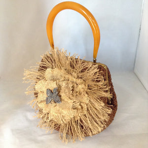 Vintage Brown Raffia Purse Signed MM With Original Amber Lucite Handle And Vintage Marquasite Blue Butterfly On Handmade Tan Burlap Rose. Dimensions - Height 7"; Length 9.5"; Depth 5.5"; Handle 5"