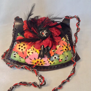 Vintage Black Leather Argentinian Crossbody Purse With Multi-Colored Flowers Cut Into The Leather. Tiny Black Tassels, Red Suede Peony With Black Feathers And Silver Robin Redbreast Adorn Front Flap. Dimensions - Height 5.5"; Width 9.75"; Depth 1.75"; Strap 24"