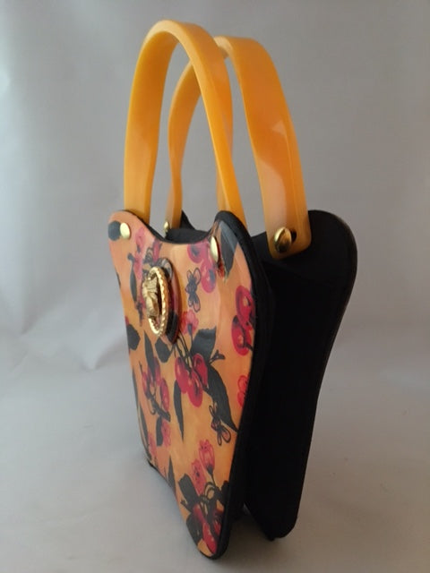 Bees love cherry blossoms, right? This little vintage yellow, black and red bag with its unusual curves is such a charmer.  Dimensions - Height 6"; Width 8"; Depth 3"; Handle 4"