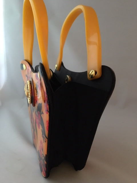 Bees love cherry blossoms, right? This little vintage yellow, black and red bag with its unusual curves is such a charmer.  Dimensions - Height 6"; Width 8"; Depth 3"; Handle 4"