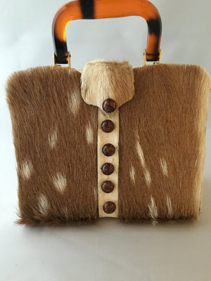 Would that be an Axis??? Square vintage handbag covered in baby deer pelt with an ostrich placket and tortoise buttons. What a combo!  Dimensions - Height 9"; Width 9"; Depth 3"; Handle 4"