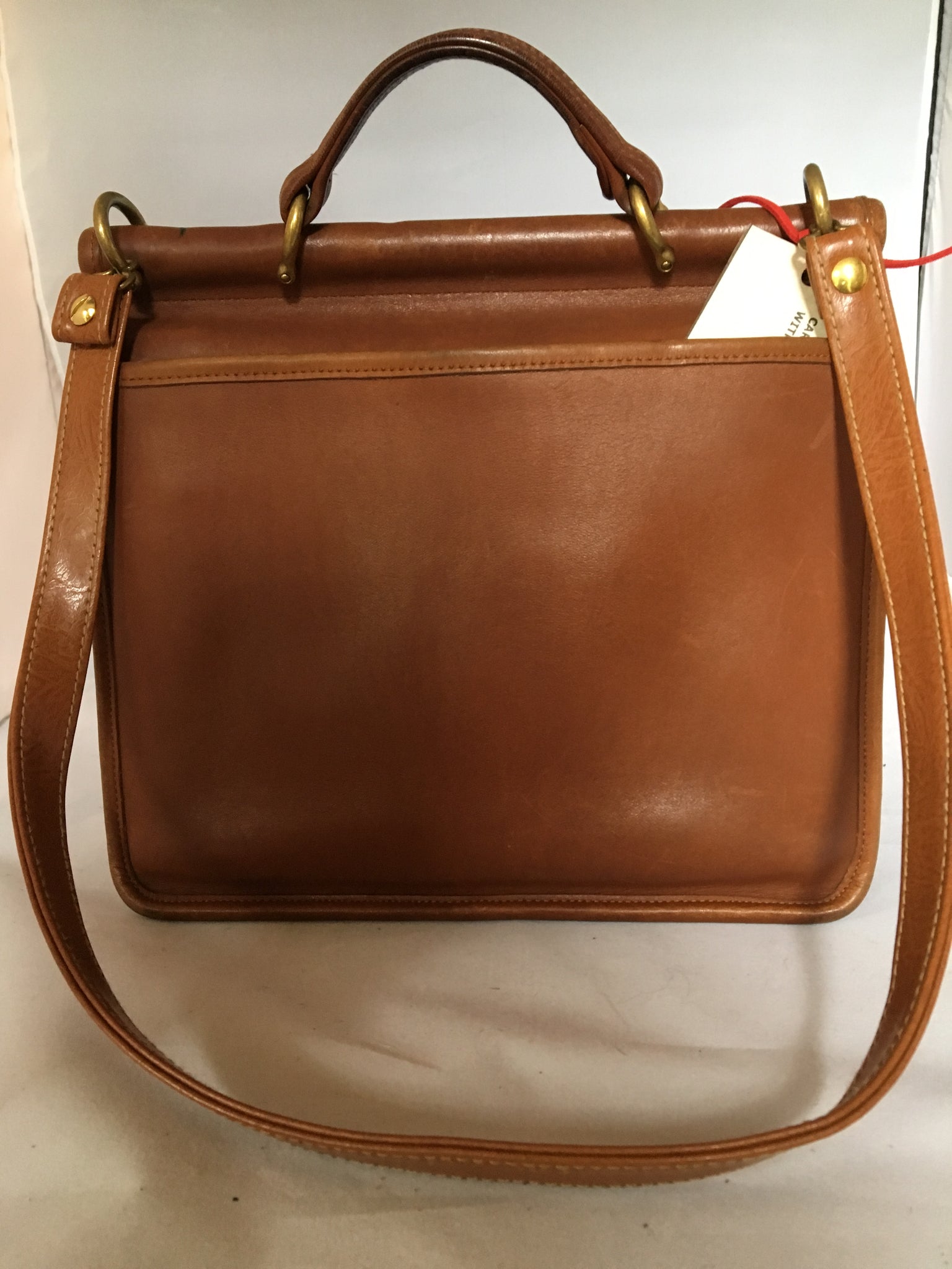 This original 1960's Coach bag has been updated with a silky soft antelope pelt. Your next business meeting will start with oohs and ahs as you take out your notebook and files.  Dimensions - Height 10"; Length 10"; Depth 3"