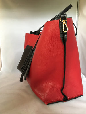 This English tote-style handbag is perfect for the world traveler since it reverses from practical black to fiery red and it even comes wit a matching clutch. How "veddy, veddy" British!   Dimensions - Height 13"; Length 12"; Depth 7"