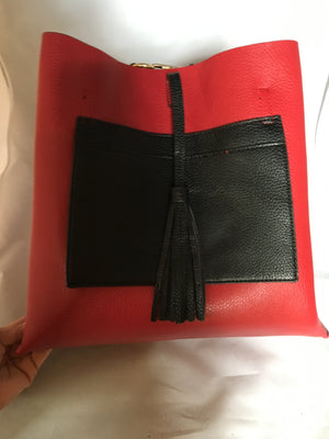This English tote-style handbag is perfect for the world traveler since it reverses from practical black to fiery red and it even comes wit a matching clutch. How "veddy, veddy" British!   Dimensions - Height 13"; Length 12"; Depth 7"