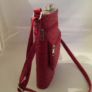 This Ultimate Tailgate Flask discretely holds 2 bottles of wine! It's made of heavy-duty insulated aluminum, comes with its own funnel and sports a shoulder strap. You'll be the hit of the parking lot! Check to see if we have it in your school colors!  Dimensions - Height 12"; Width 7"; Depth 2"